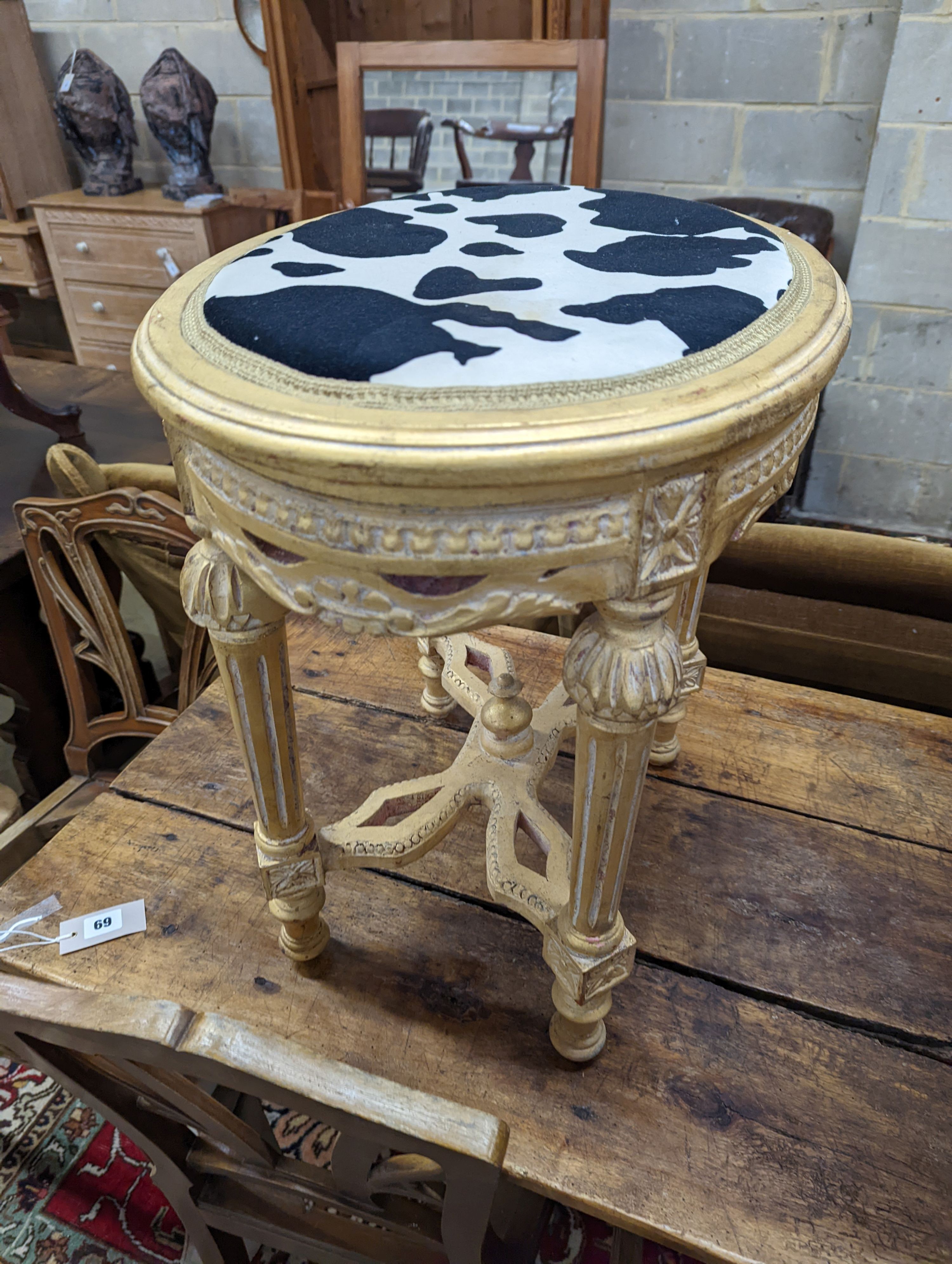 An oval gilt stool with faux zebra top, elbow chair and marble top occasional table. Chair height - 83cm.